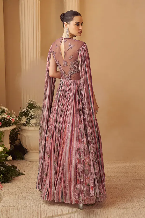 Back view of rose pink cape style wedding gown with front-and-back embroidery