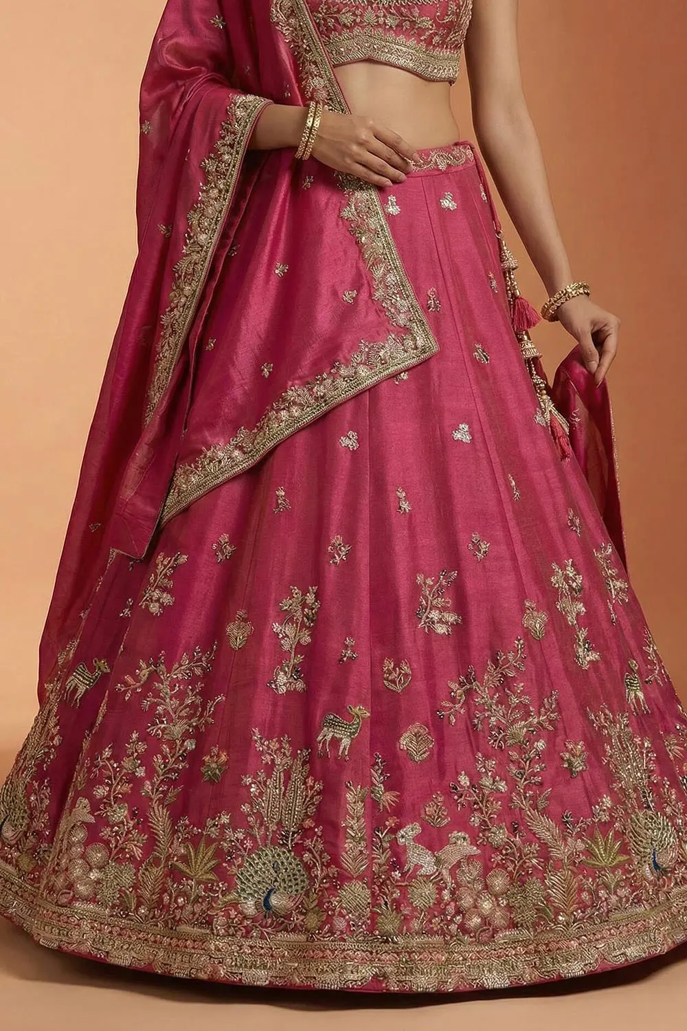 Cutwork hem of the pink lehenga photographed from below