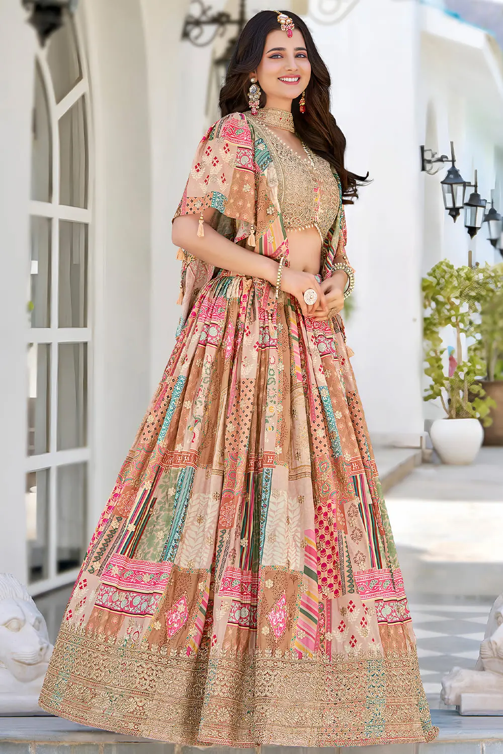 Side angle view of beige lehenga flare with chiffon dupatta draped