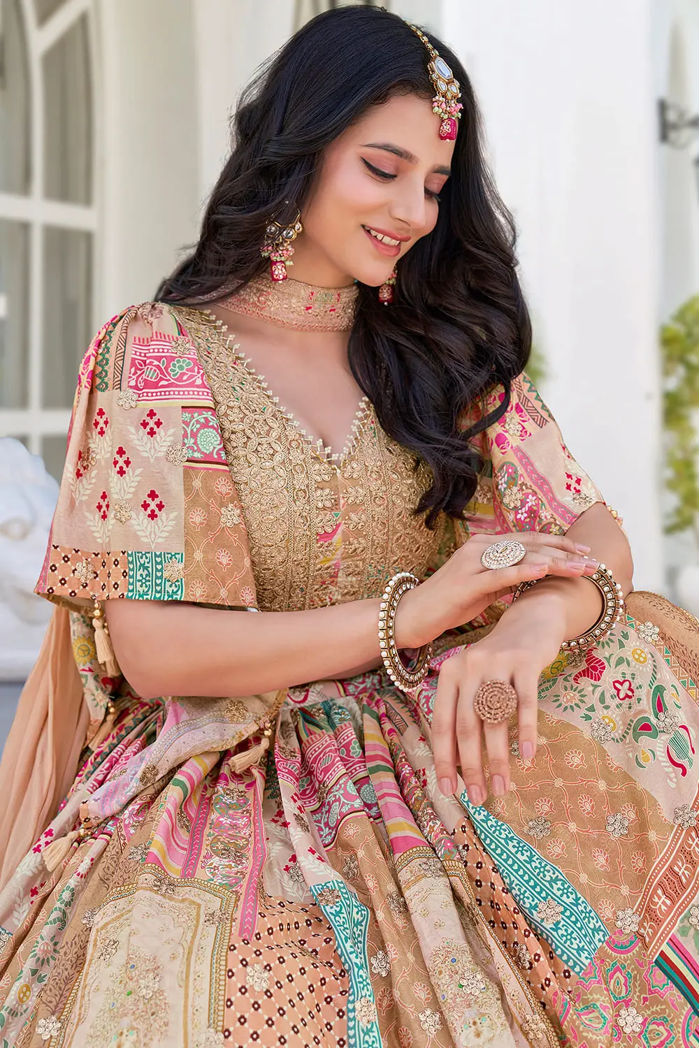Close up of digital print and zari dori embroidery on beige chinon silk lehenga