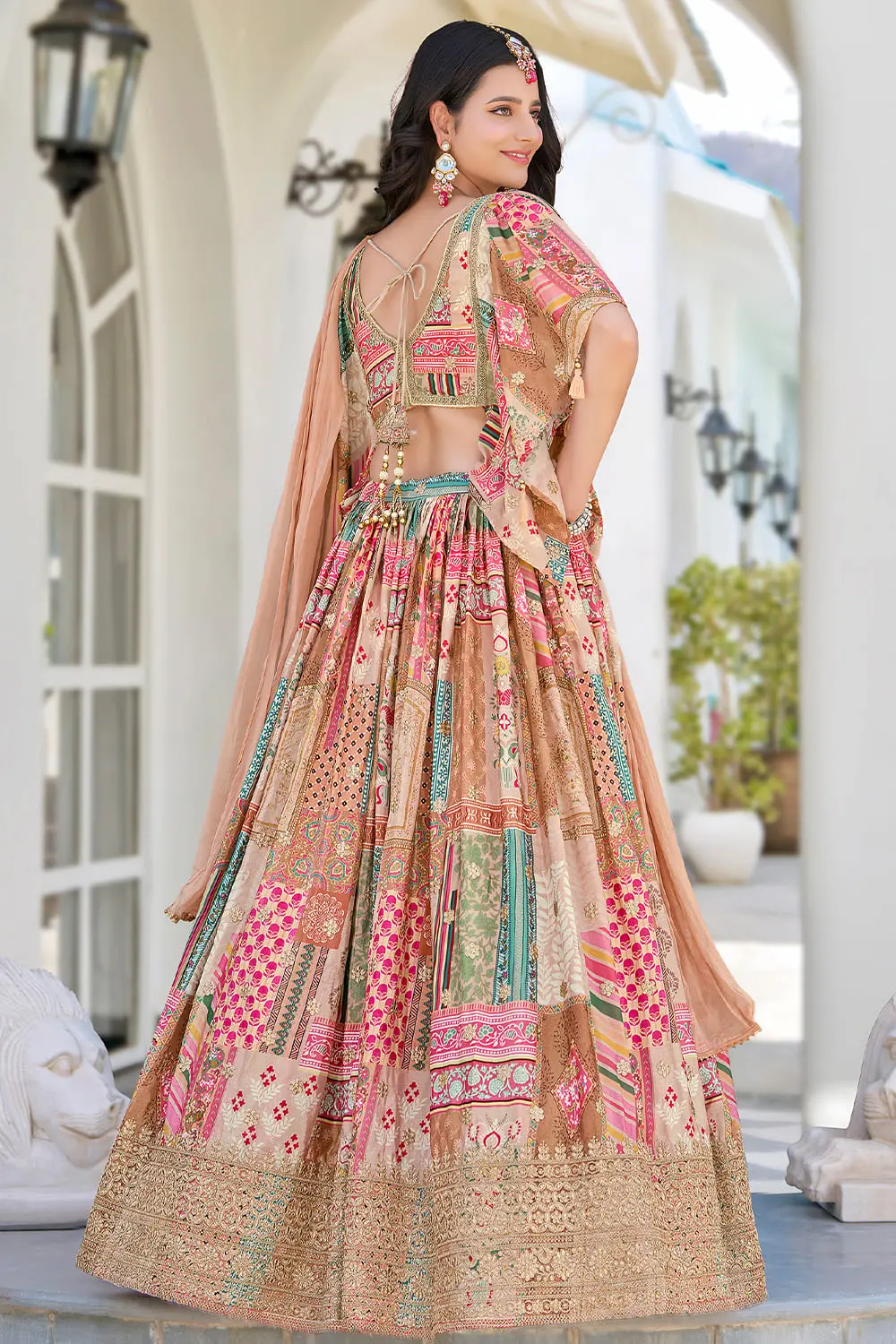 Back view of beige chinon silk lehenga showing full flare