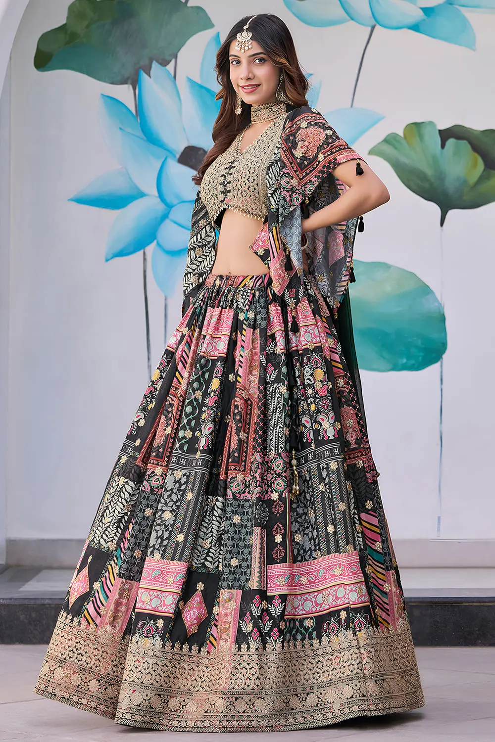 Side angle view of black lehenga flare with chiffon dupatta draped