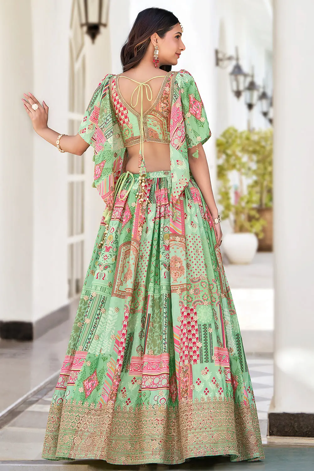 Back view of green chinon silk lehenga showing full flare