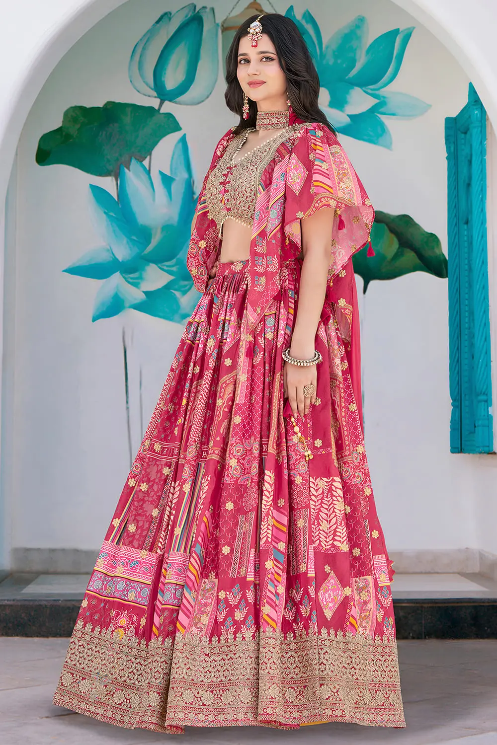Pink lehenga side profile, chiffon dupatta lifted mid-step
