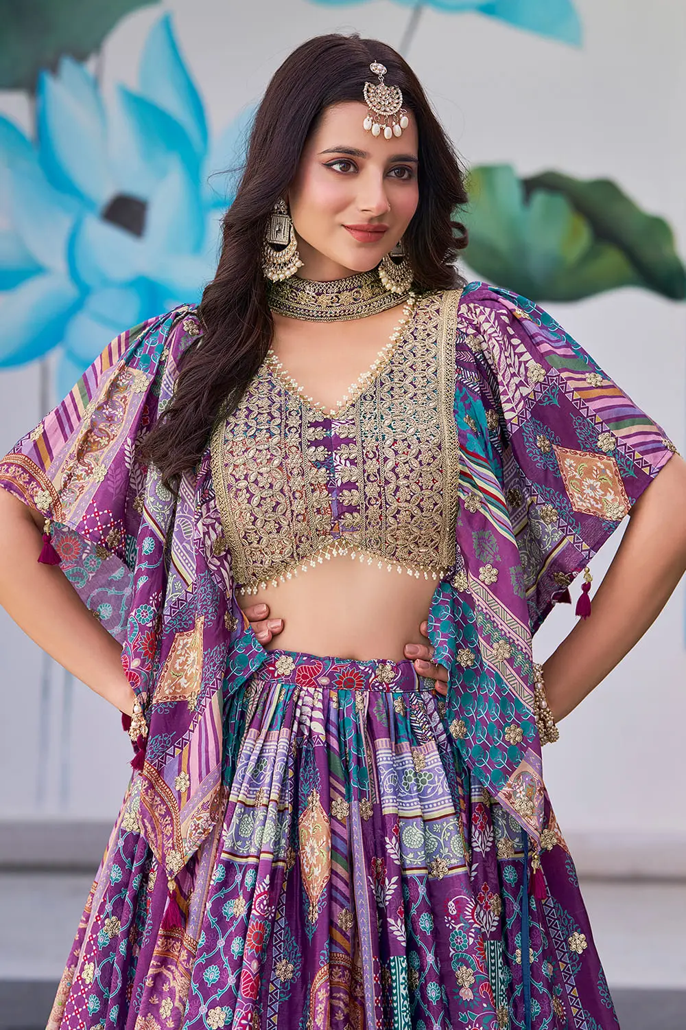 Zari dori border detail on the purple chinon silk lehenga's digital print