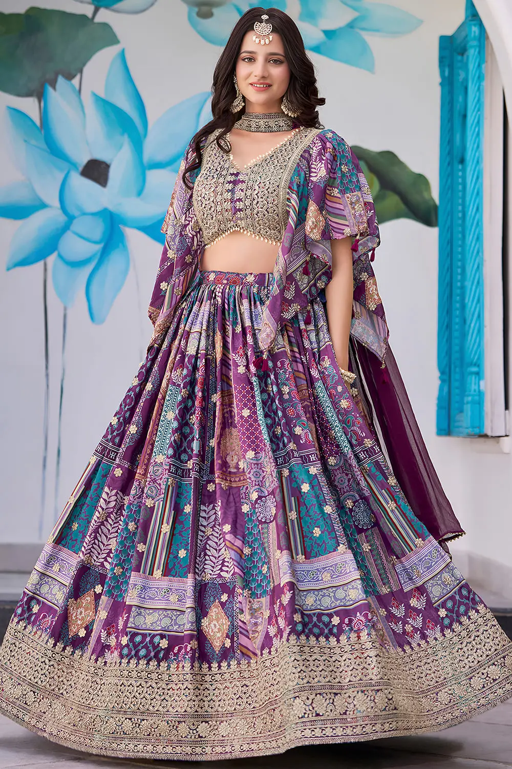 Purple chinon silk lehenga, chiffon dupatta pinned at the shoulder, front view