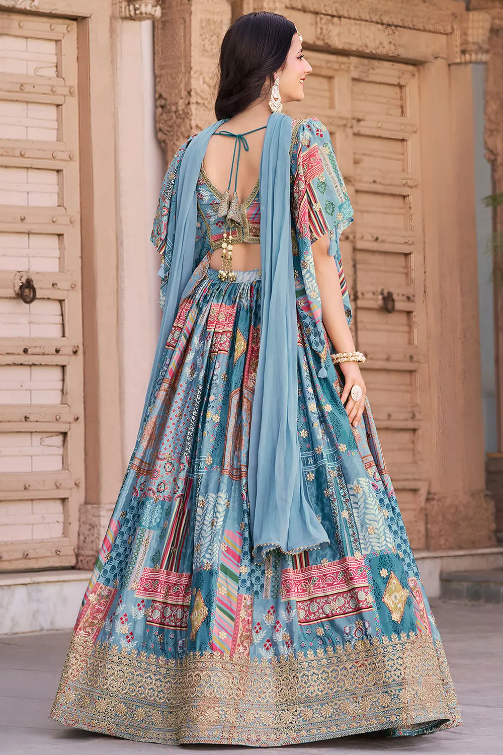 Sky blue chinon silk lehenga viewed from the back, flare fully visible