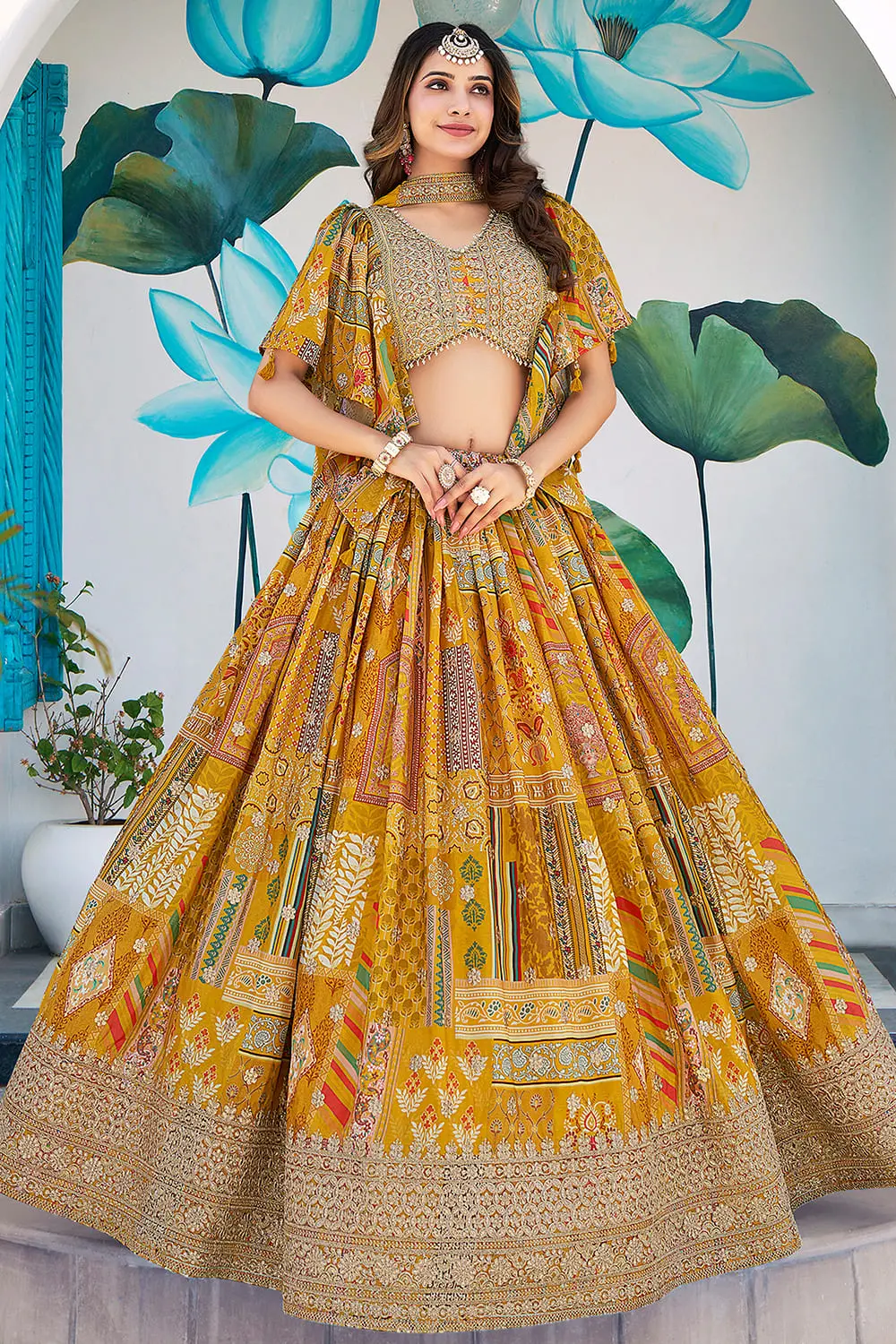 Yellow chinon silk lehenga, front view, chiffon dupatta draped for a family function