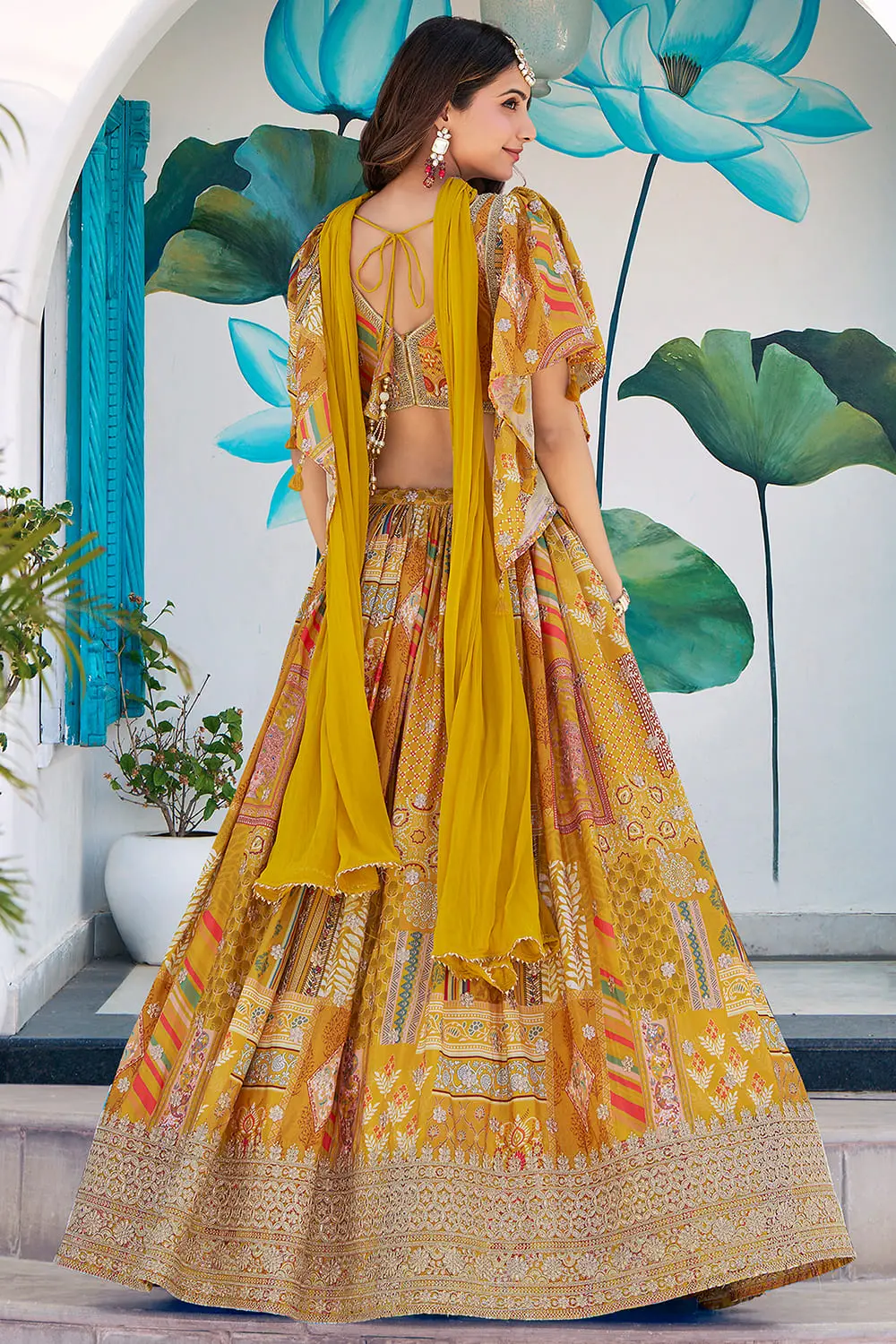 Yellow chinon silk lehenga viewed from the back, flare fully visible