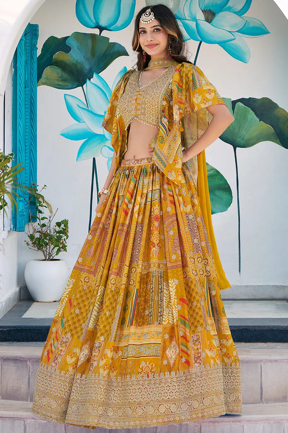 Yellow lehenga in profile, seated position showing how the flare sits