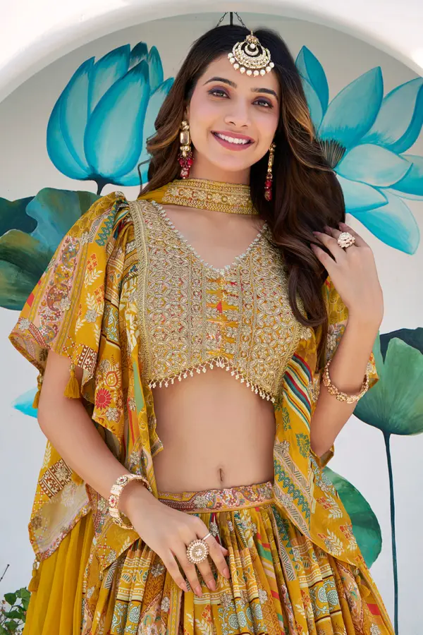 Zari dori embroidery detail along the digital print of the yellow lehenga