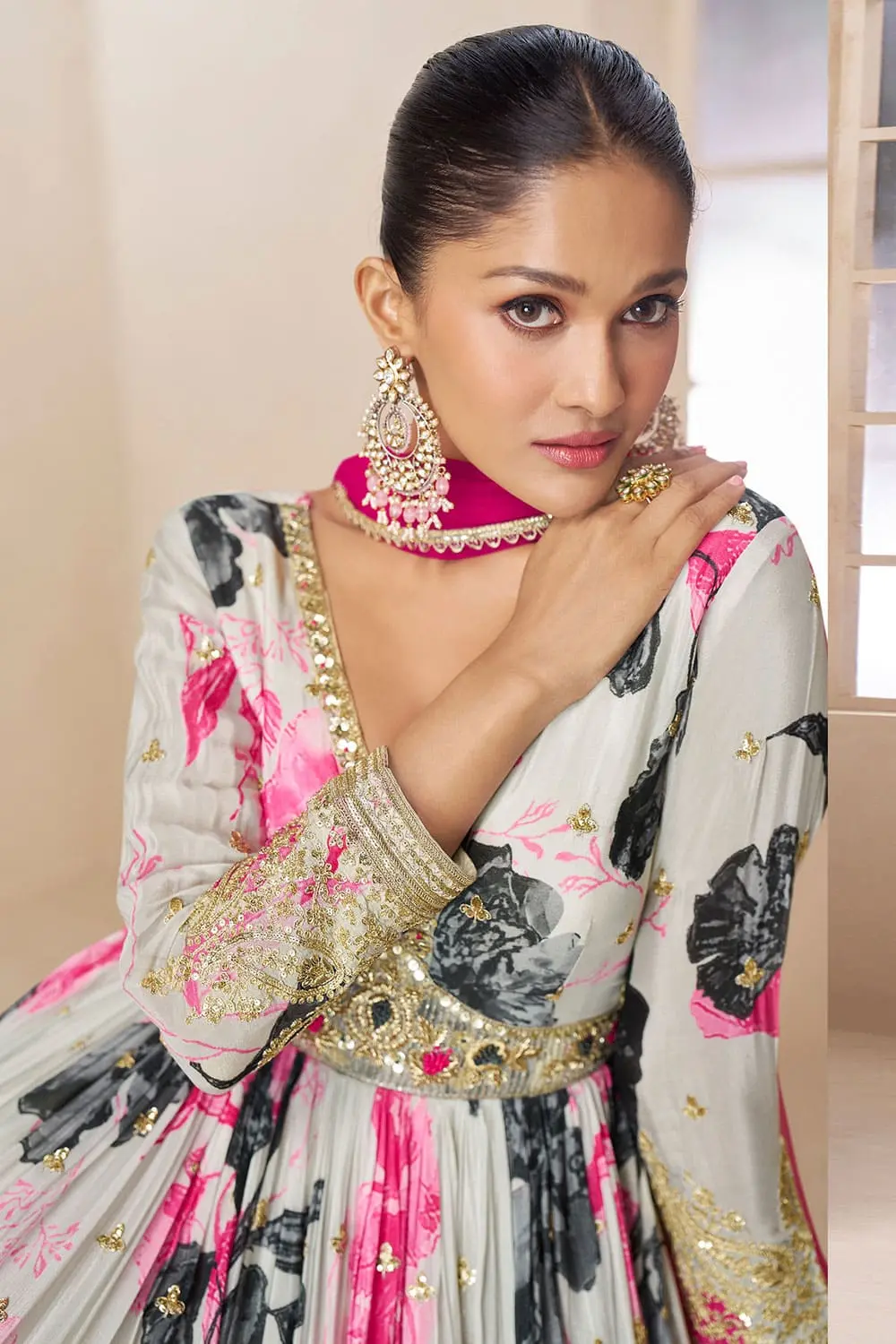 Close up of floral digital print and embroidery detail on ivory and pink chinon anarkali gown