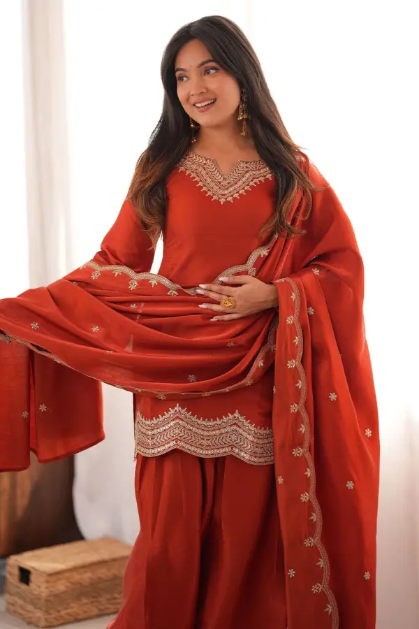 Close up dori work on orange pakistani salwar kameez