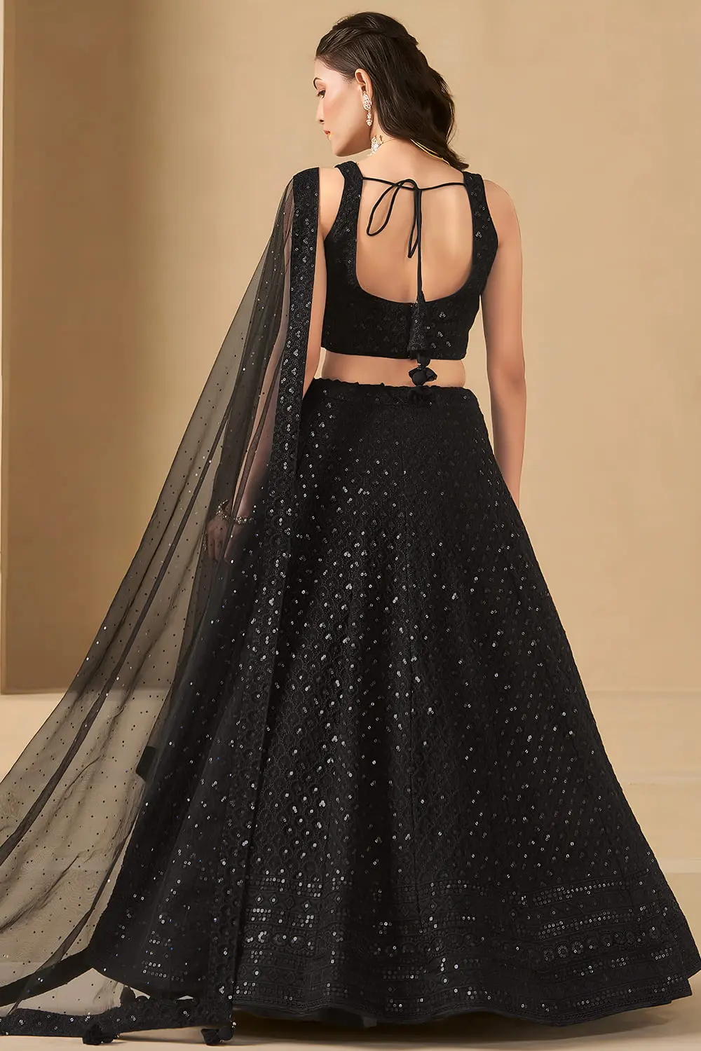Back view of black georgette lehenga with soft net dupatta