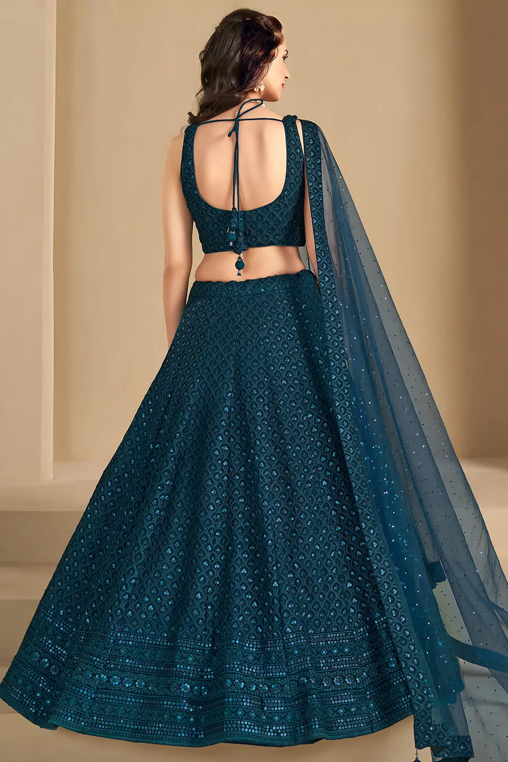 Elegant back design of the embroidered blue wedding chaniya choli