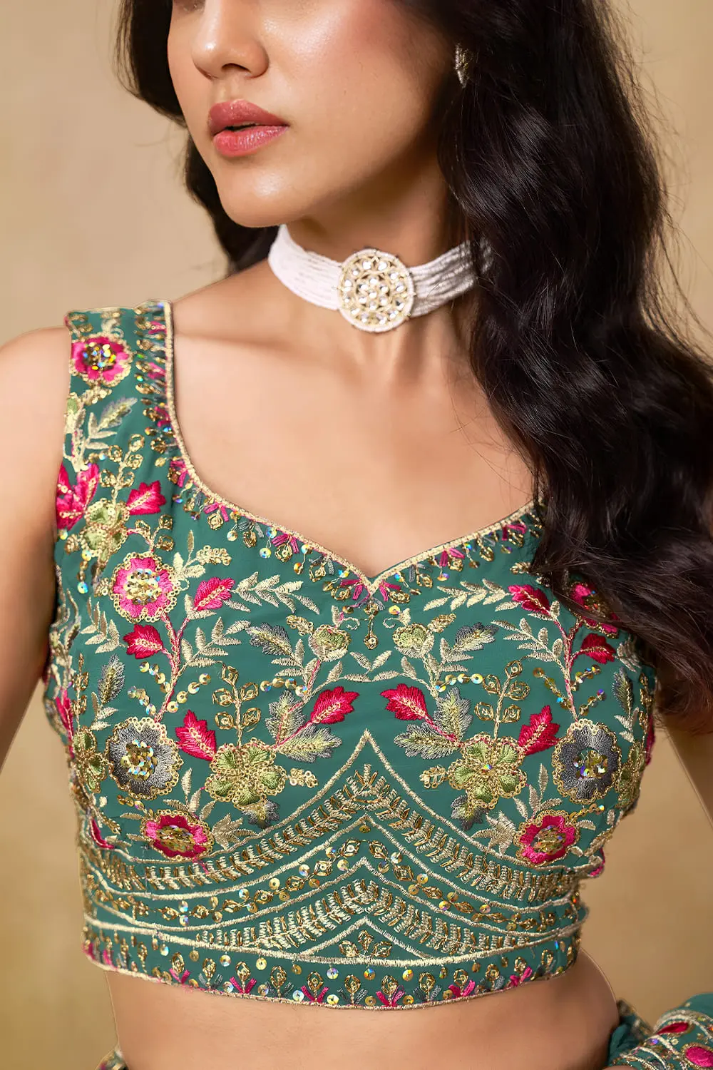 Close up of blue georgette lehenga blouse with sequin work