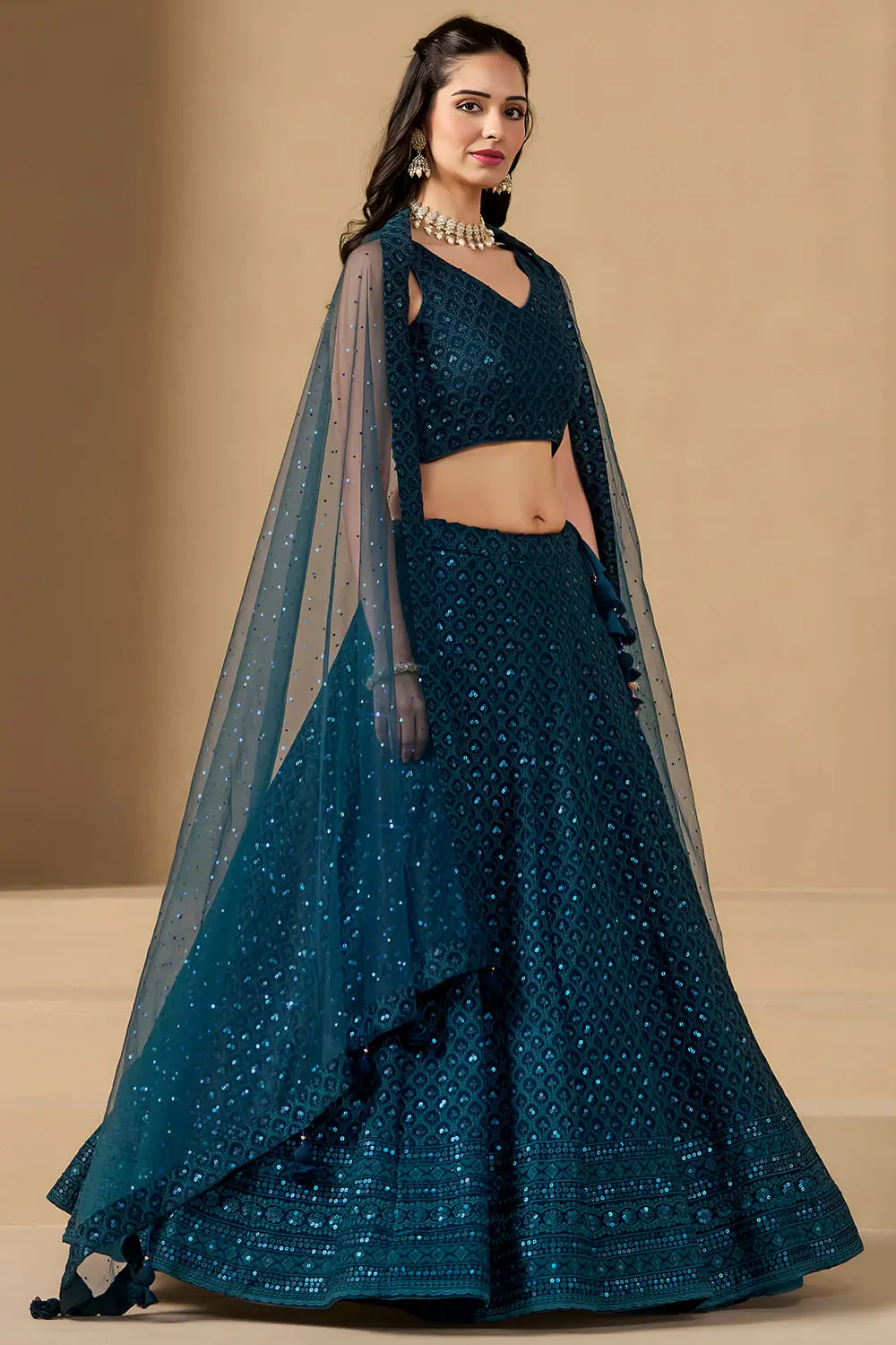 Left twirl view of the voluminous blue indian guest outfit