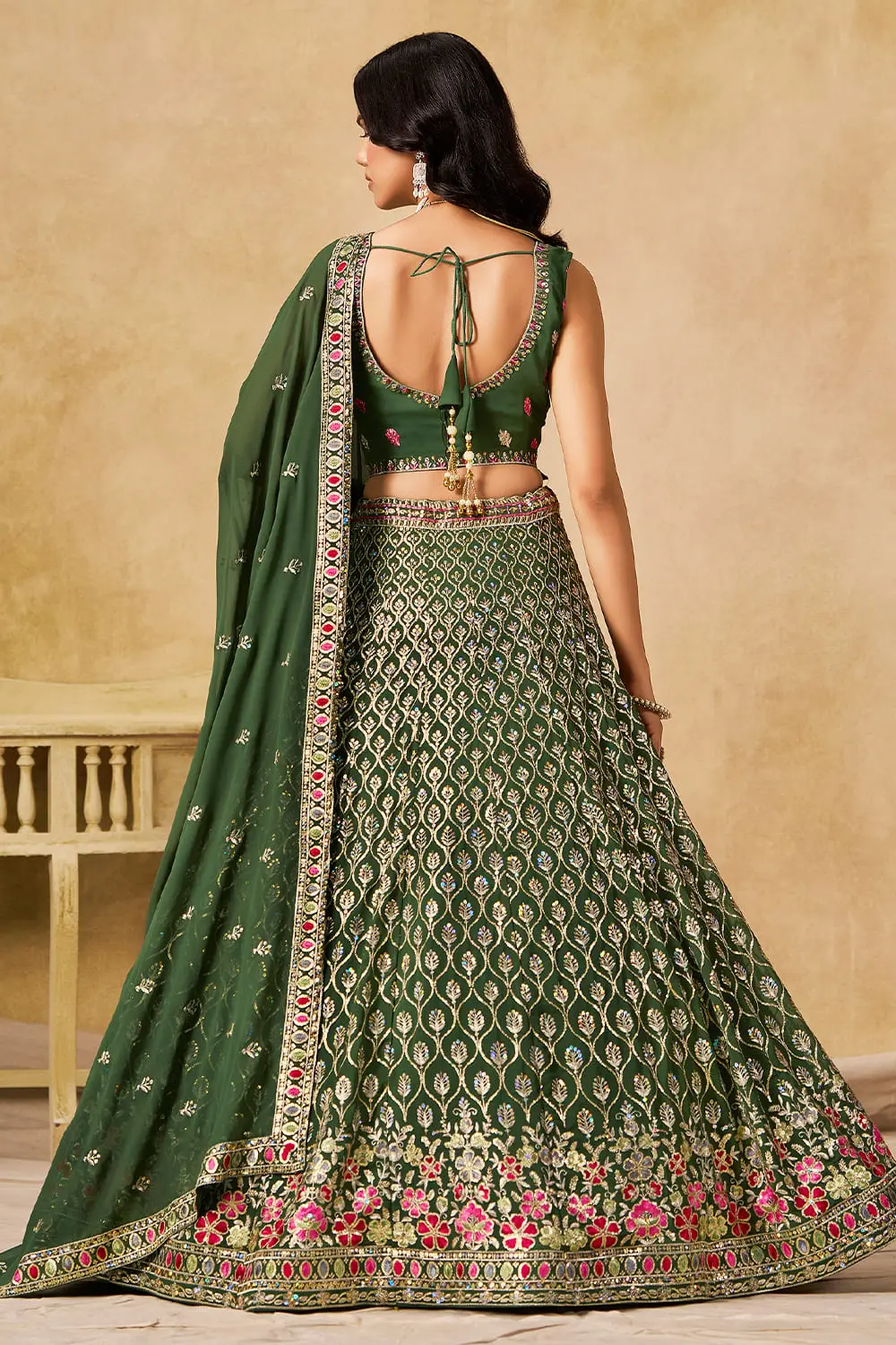 Back view of green sequin georgette lehenga set