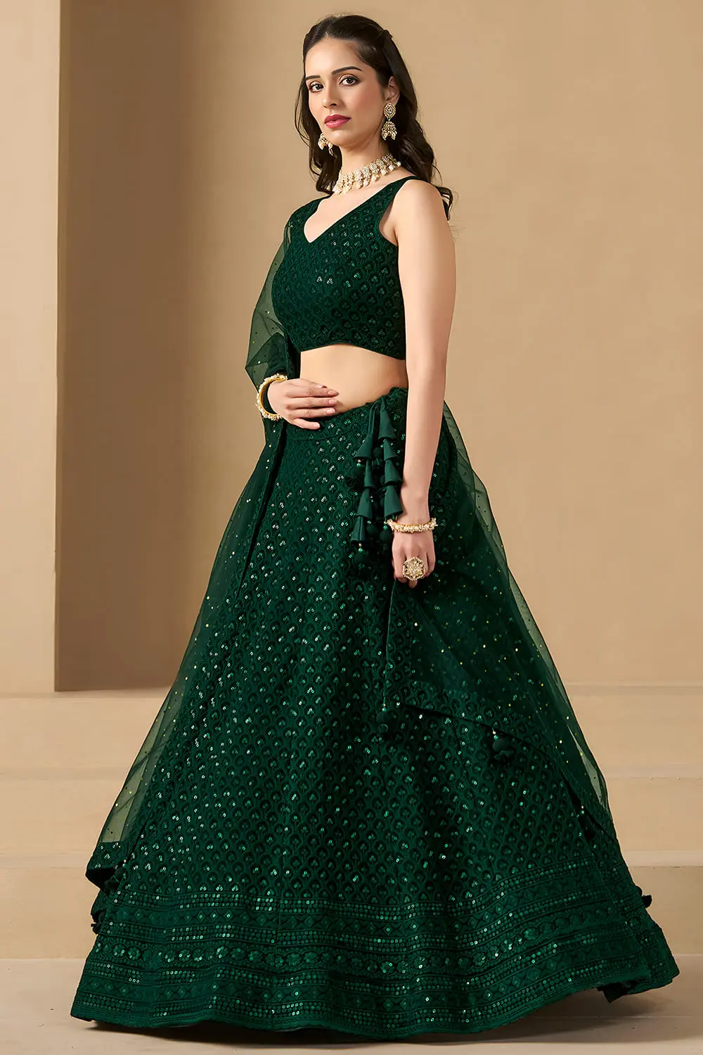 Right side view showing the beautiful flared silhouette of the green ghaghra choli