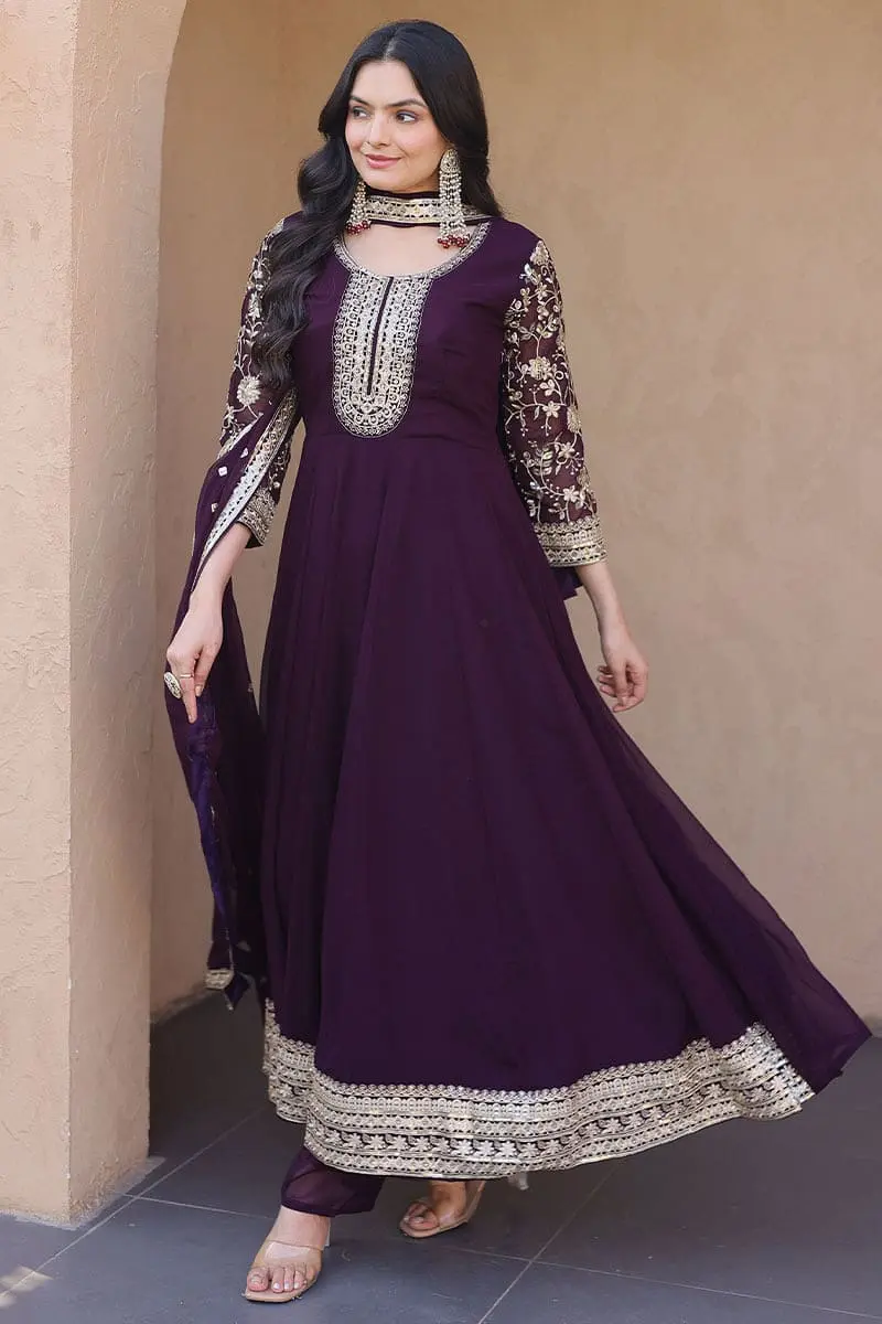Woman wearing stunning deep purple faux blooming anarkali gown