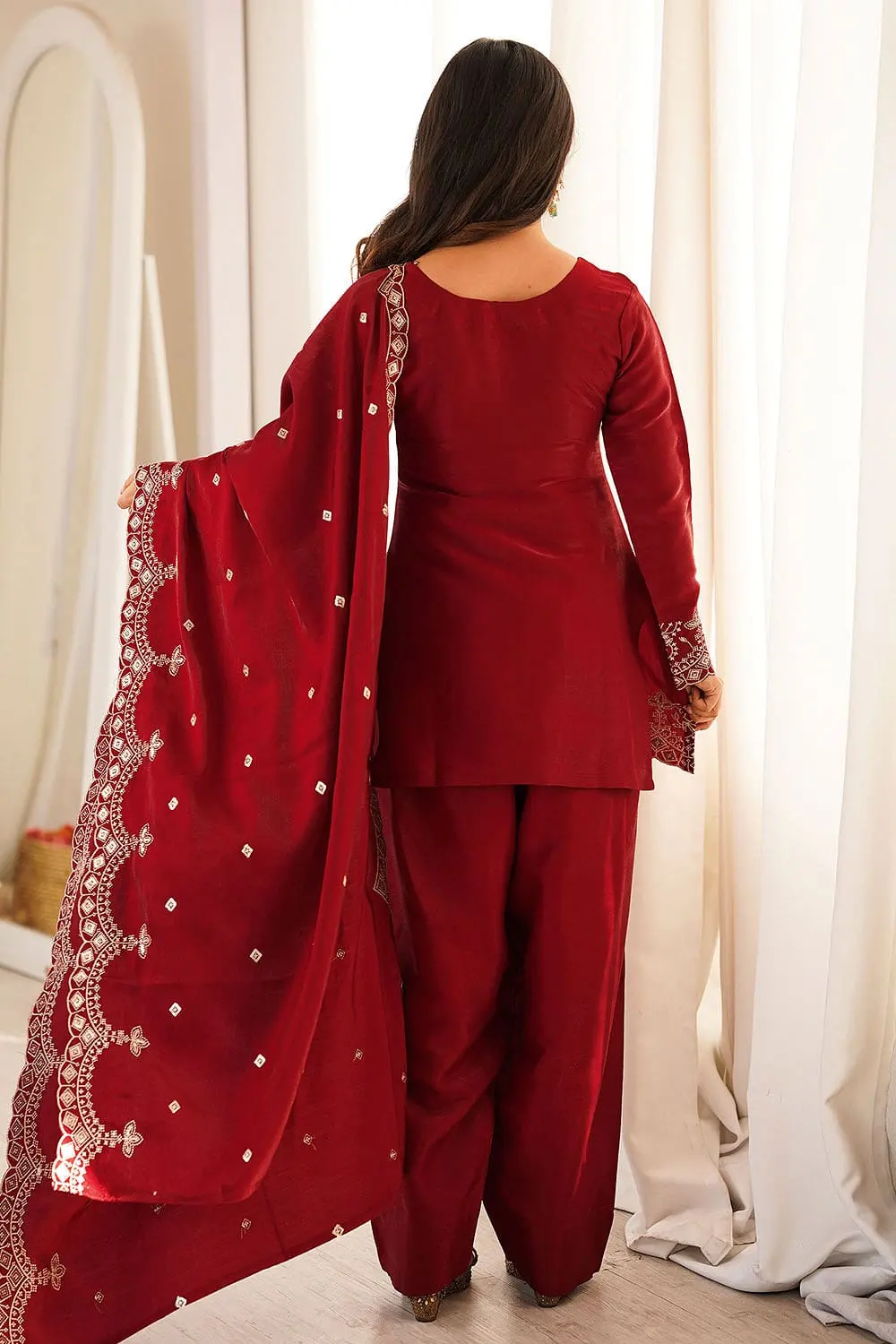 Back styling of maroon designer silk kurta set
