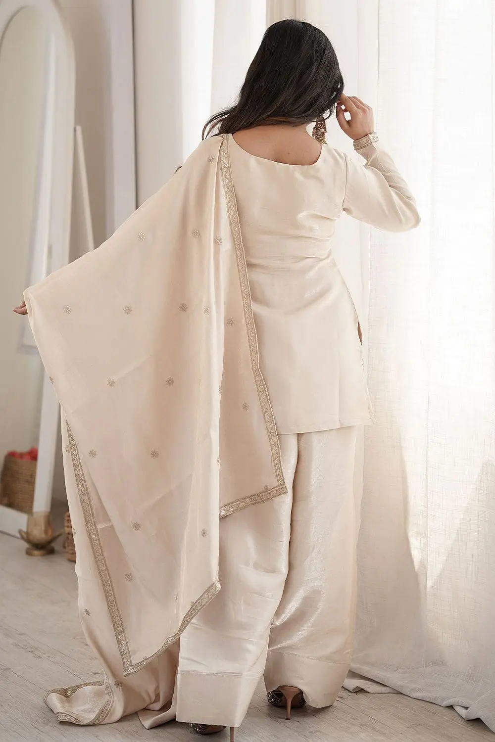 Back styling off white silk salwar suit