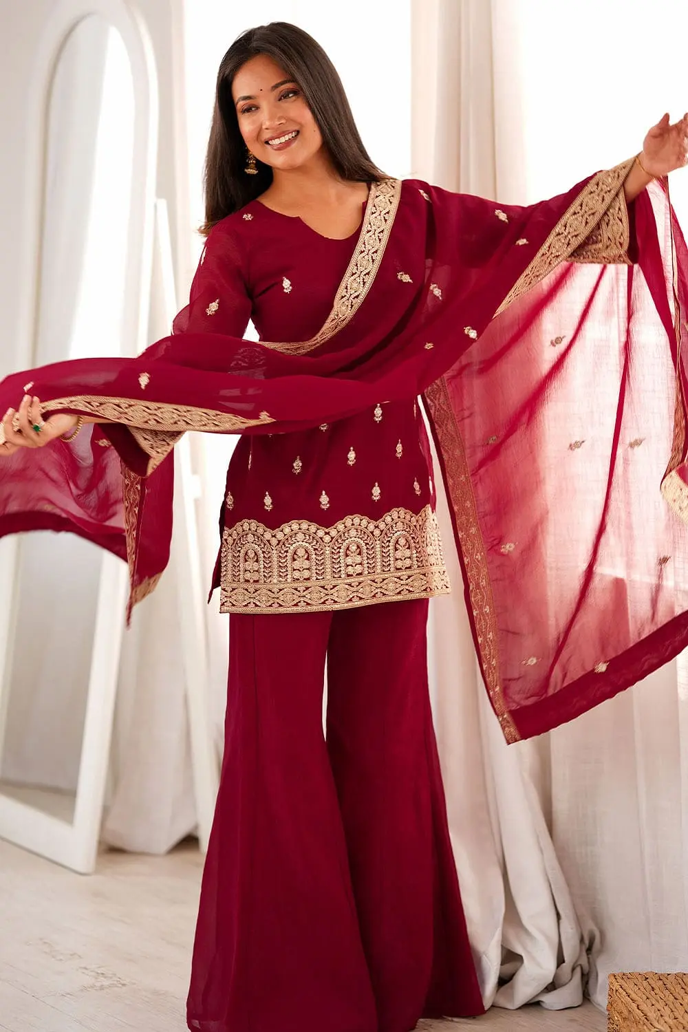 Beautiful model in maroon sharara set for wedding