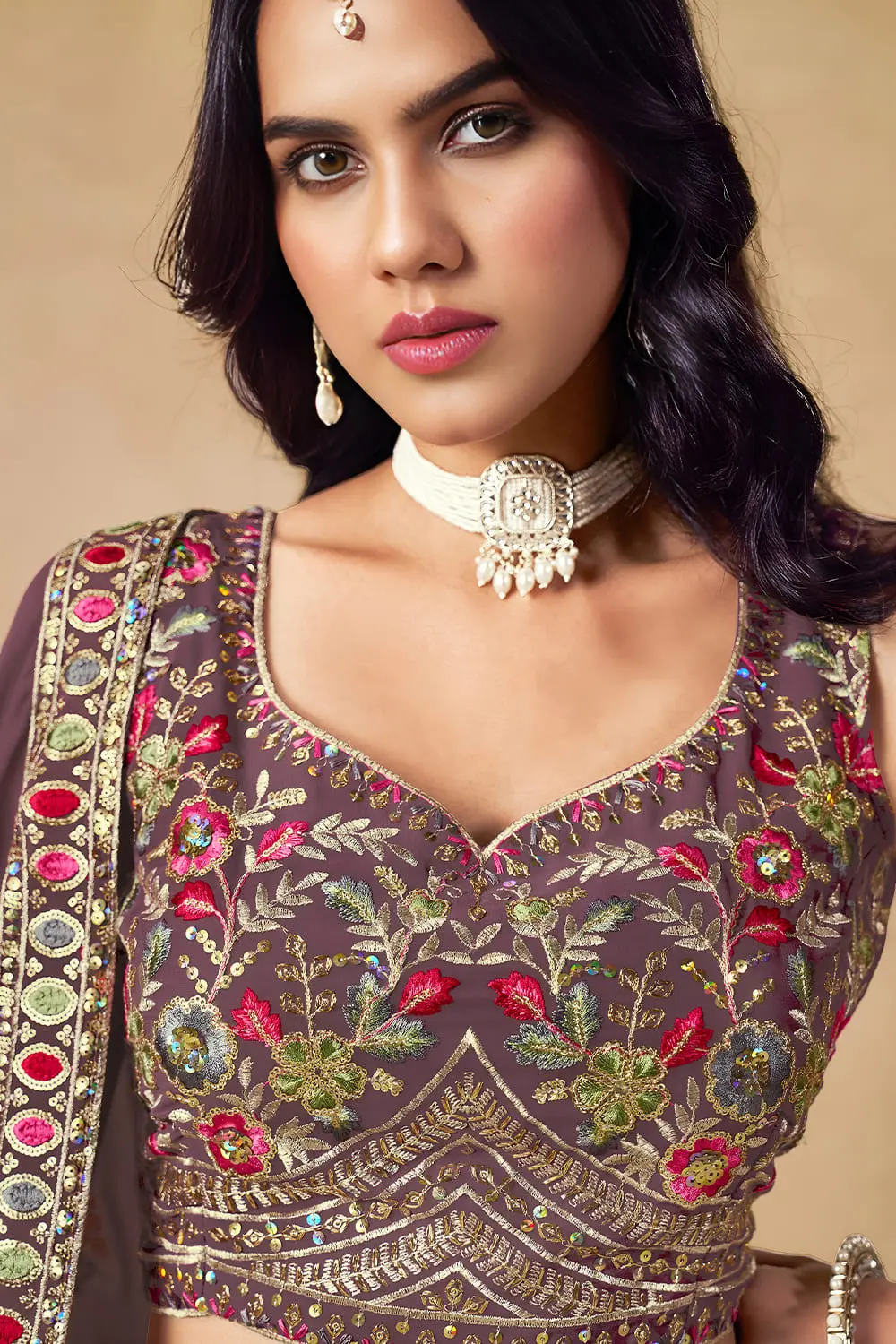 Close up of purple georgette lehenga blouse with sequin work