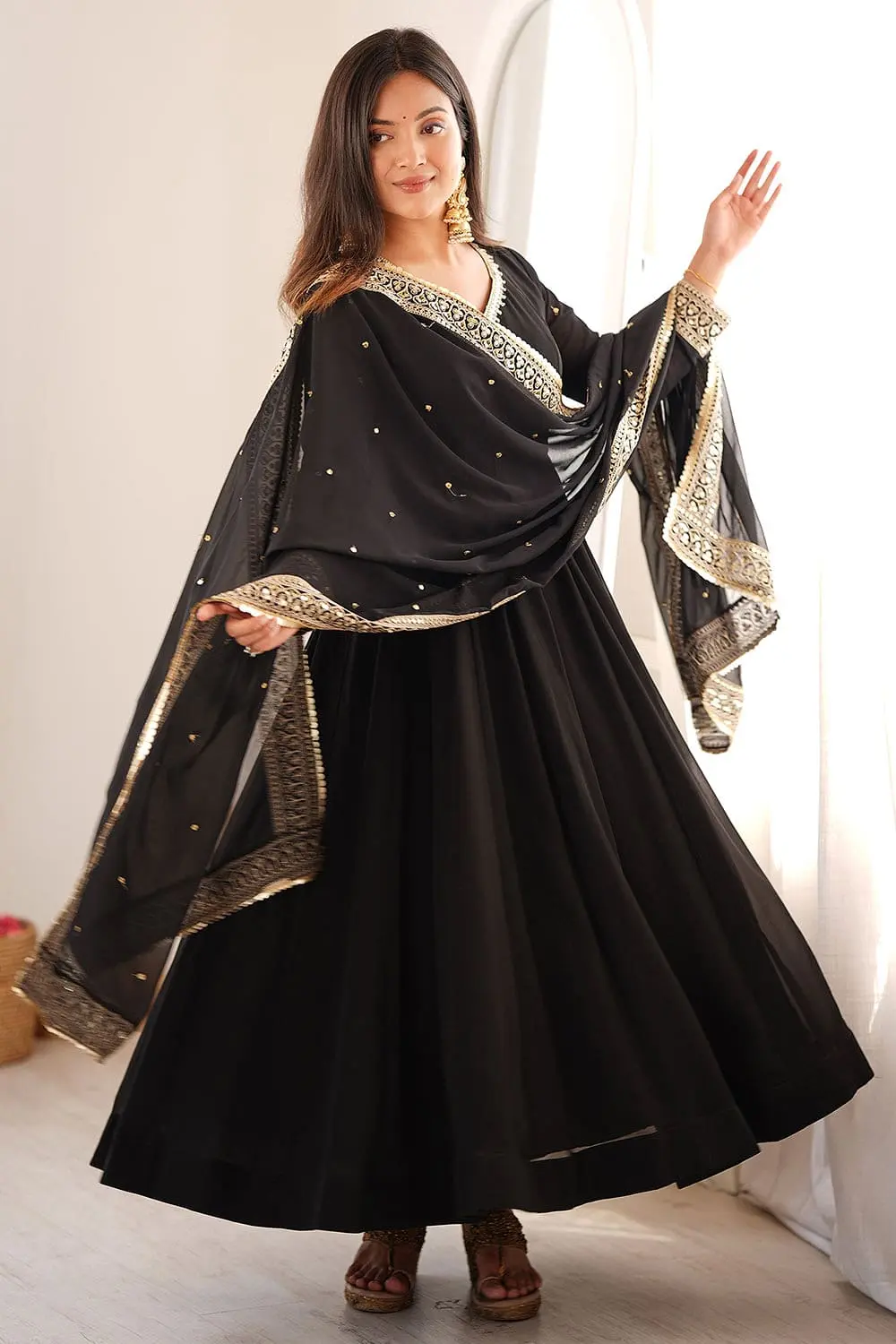 Beautiful back design and tailoring of the black georgette anarkali set.