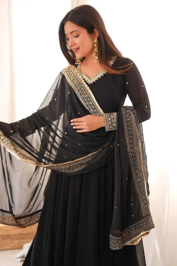 Close-up detailing of the premium fabric on the black georgette anarkali set.