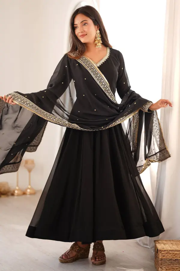 Beautiful woman wearing a stunning black georgette anarkali set for evening events.