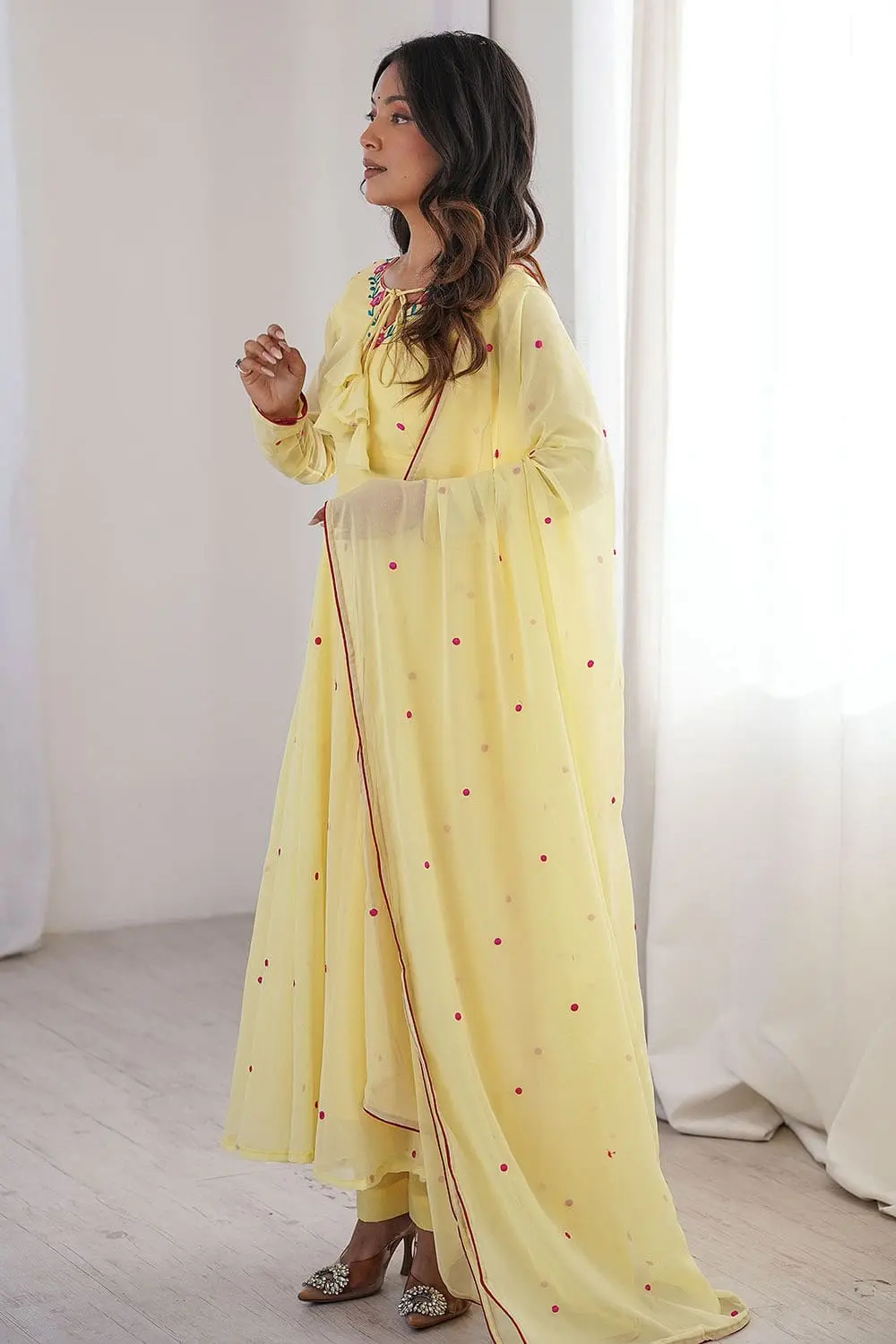 Yellow designer anarkali set second front view showing full anarkali length and dupatta draped