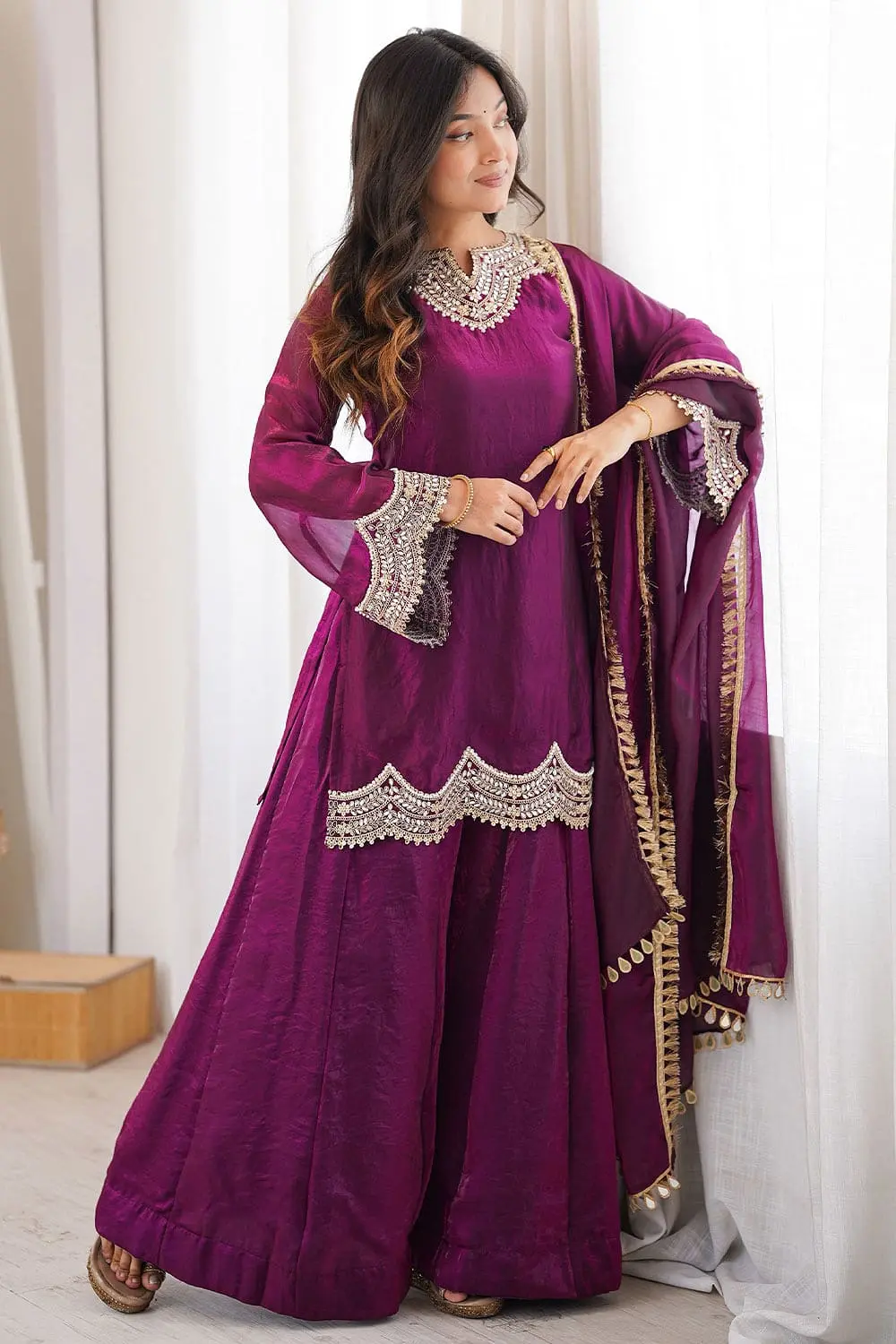 Model in elegant purple party wear salwar kameez