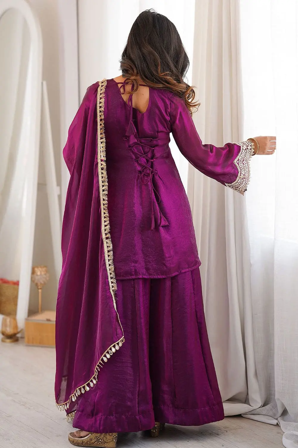 Back design of purple party wear salwar kameez