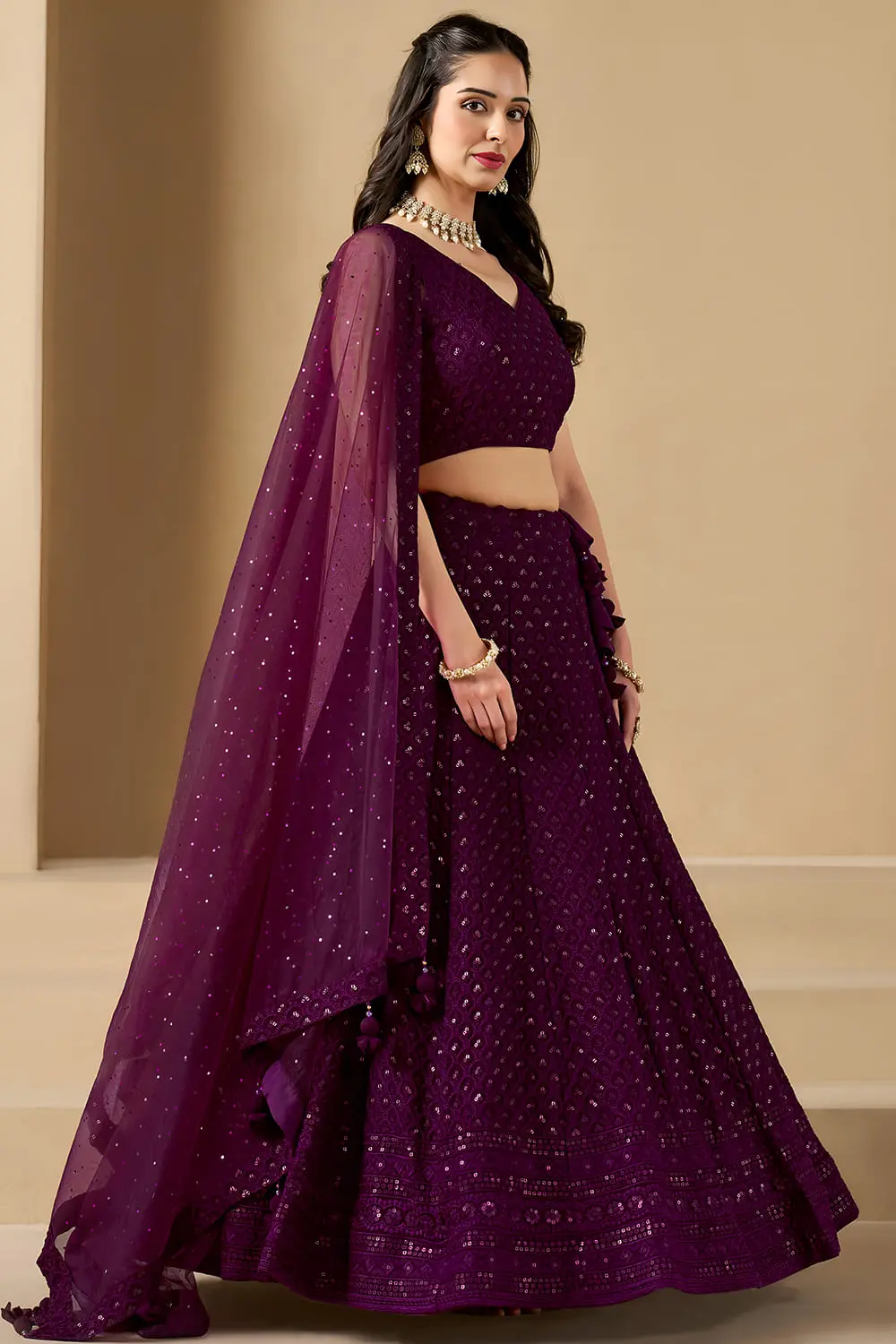 Left angle twirl capturing the high-fidelity movement of the soft net dupatta