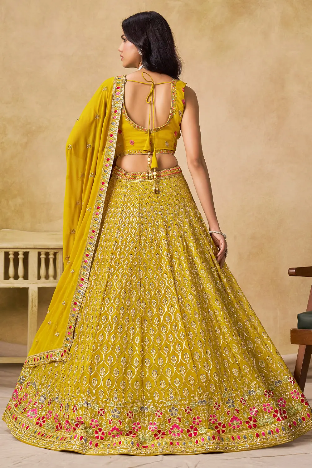 Back view of yellow sequin georgette lehenga set